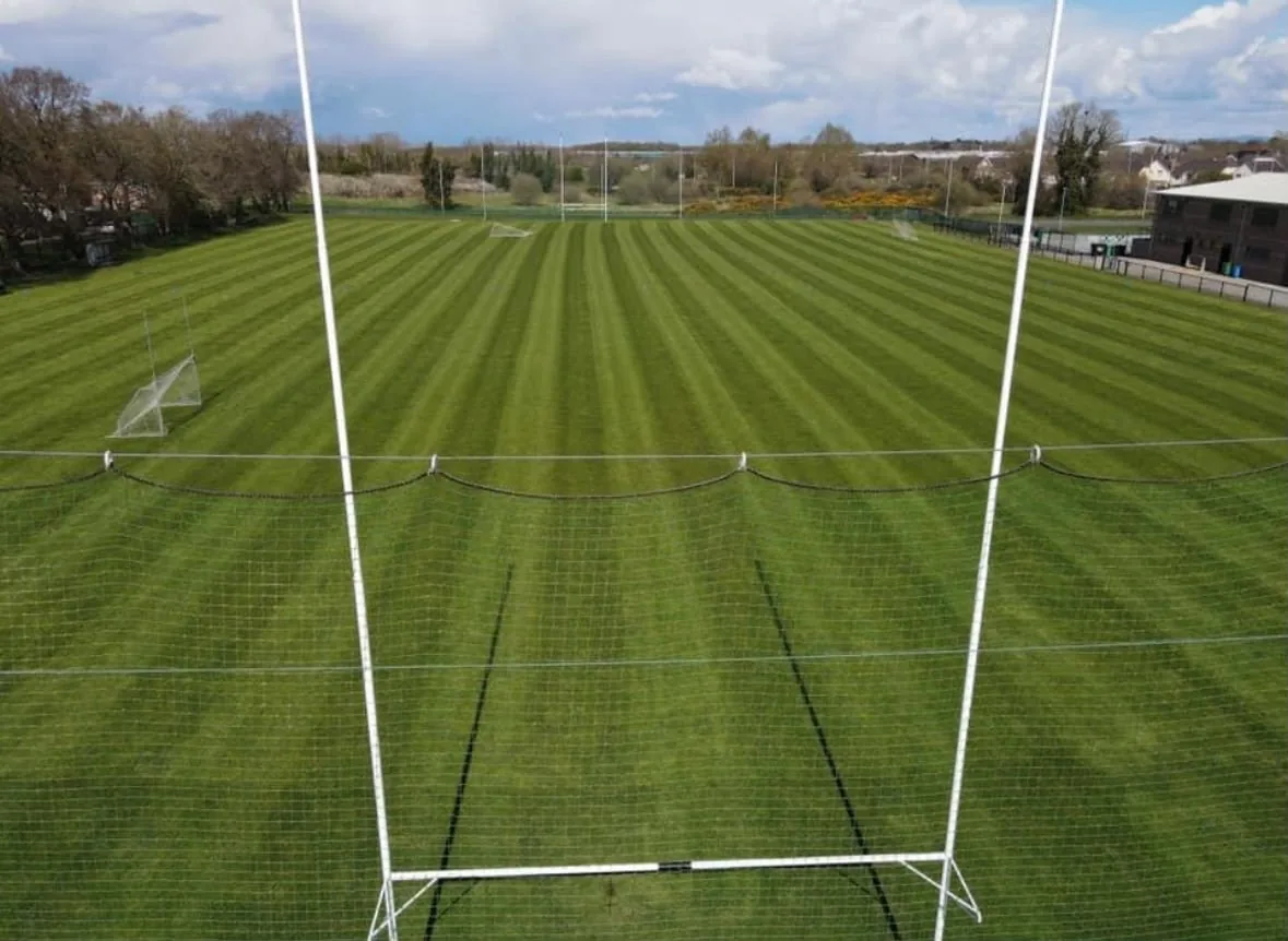 Freshly cut striped main pitch, seen from behind the goal